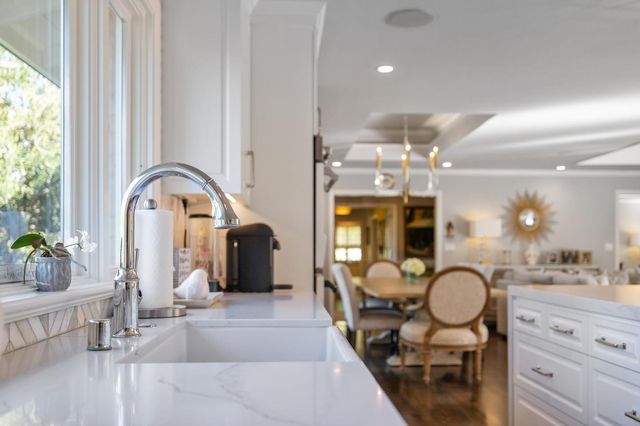 a bedroom with a large bed and a book shelf