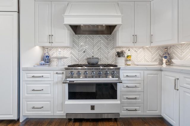 a bedroom with a large bed and a large window