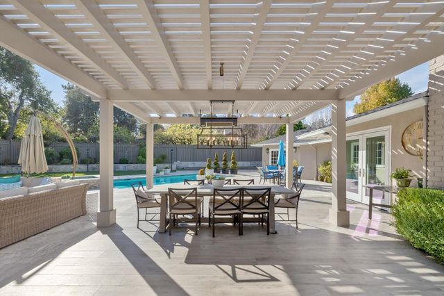 a spacious bathroom with a double vanity sink mirror and shower