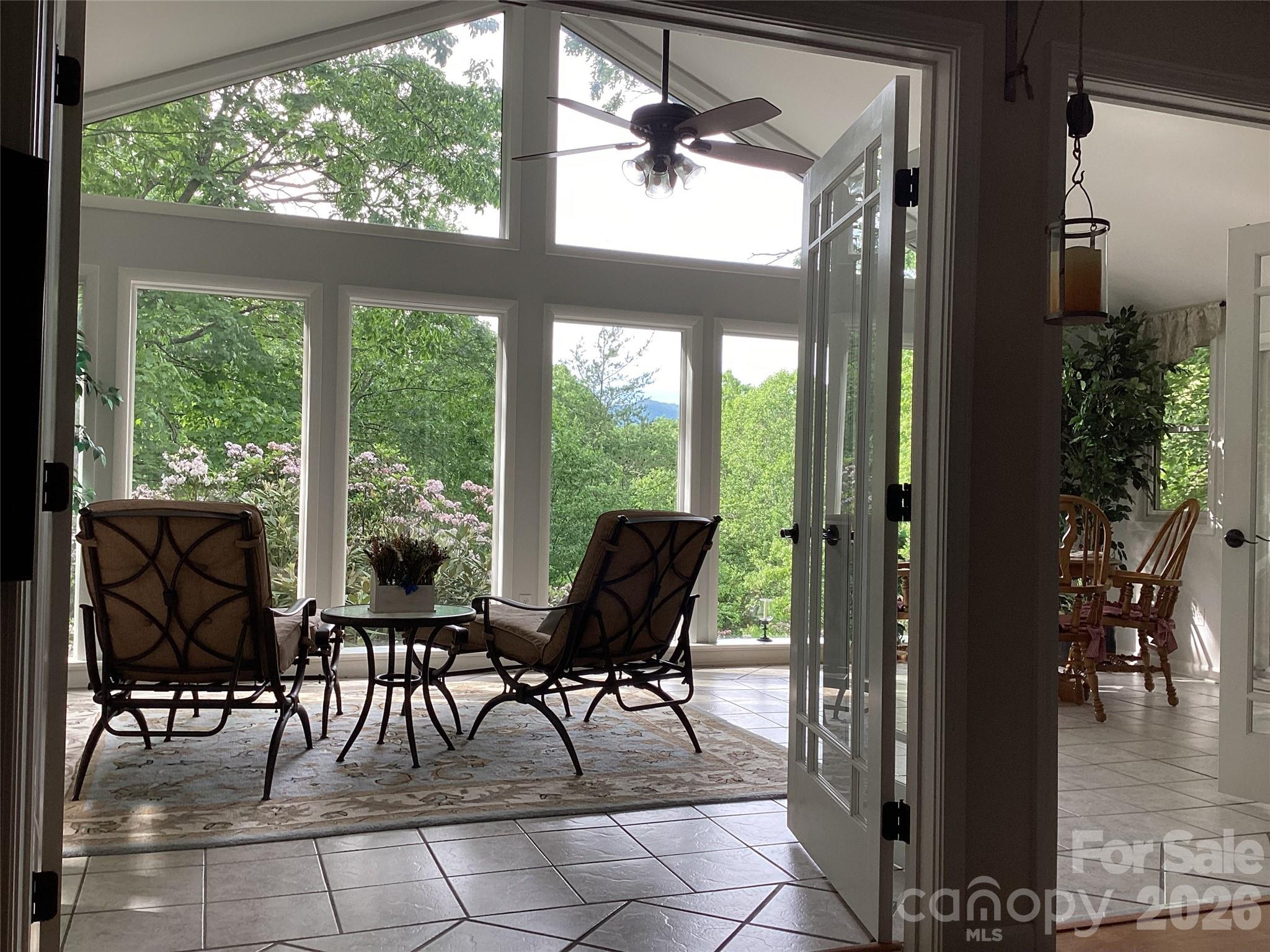 31 Rhododendron Road Black Mountain, NC 28711 - Photo 3 of 27 a view of a porch with chairs and backyard