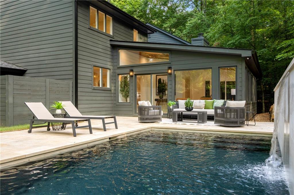8120 Ball Mill Road Northeast Atlanta, GA 30350 - Photo 84 of 95 a view of a patio with a table and chairs under an umbrella