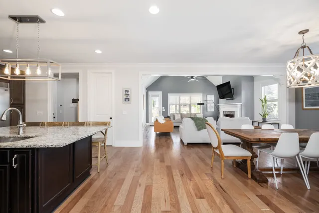 a kitchen with a center island and stainless steel appliances