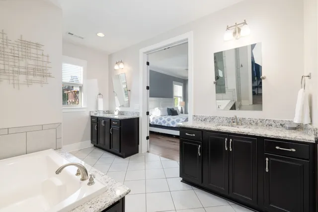 a view of walk in closet with clothes