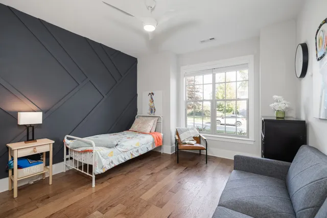 a view of a hallway with paintings on the wall