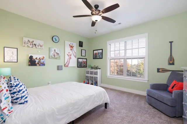 a view of a livingroom with workspace and a window