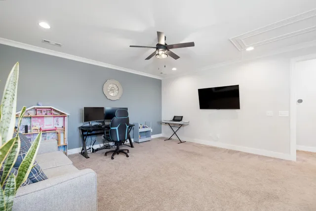 a view of a house with a yard and sitting area