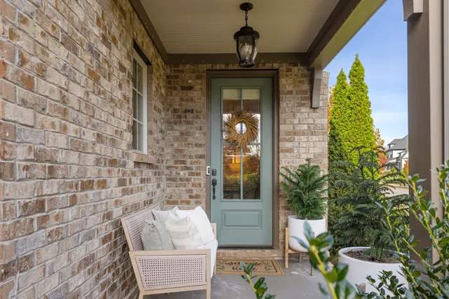 a front view of a house with outdoor seating