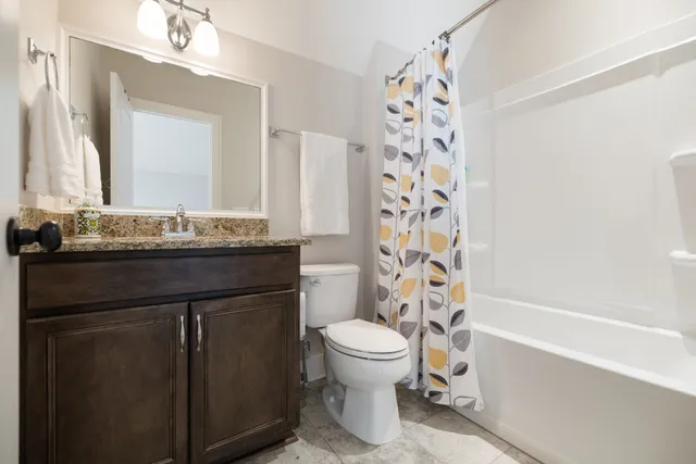a view of a house with swimming pool and porch with furniture