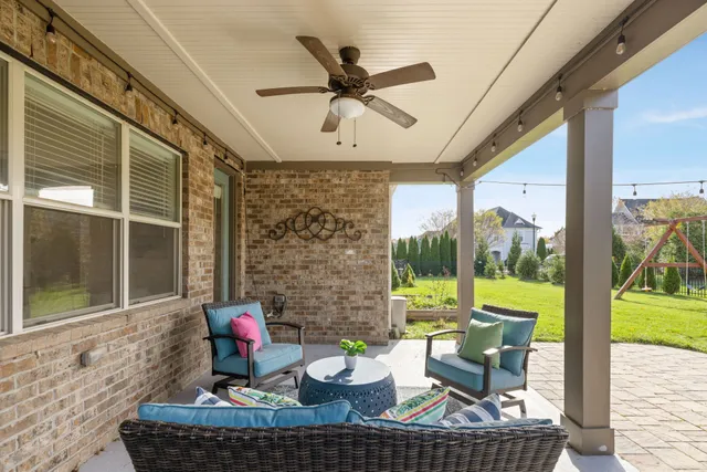 an aerial view of a house with garden space and lake view