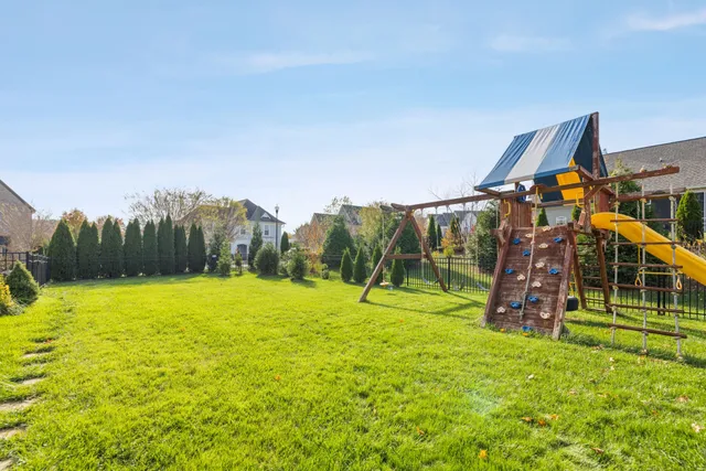 a view of a backyard with sitting area