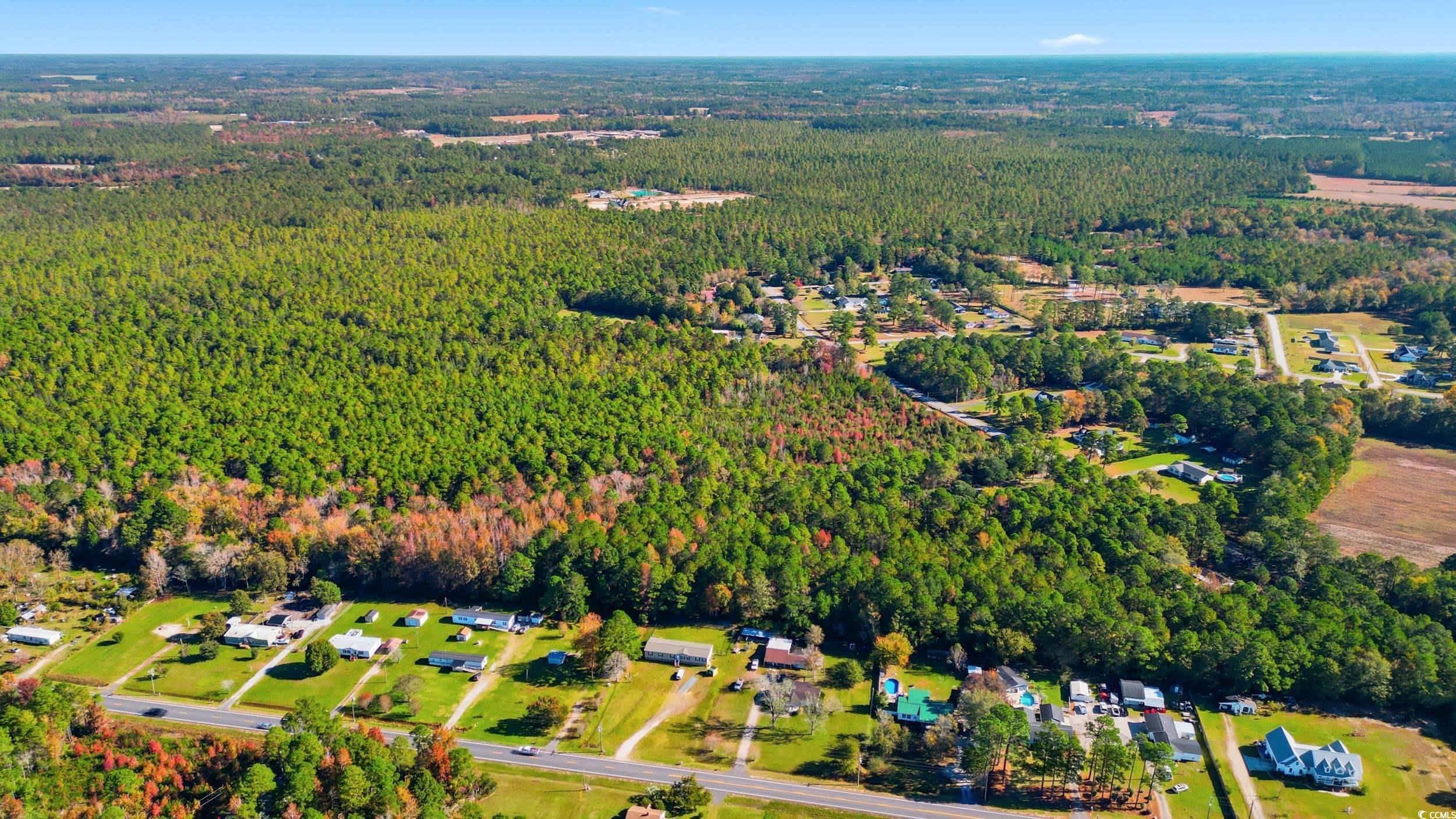 0 Heritage Road Loris, SC 29569 - Photo 4 of 9 Aerial overview of property's location featuring a heavily wooded area