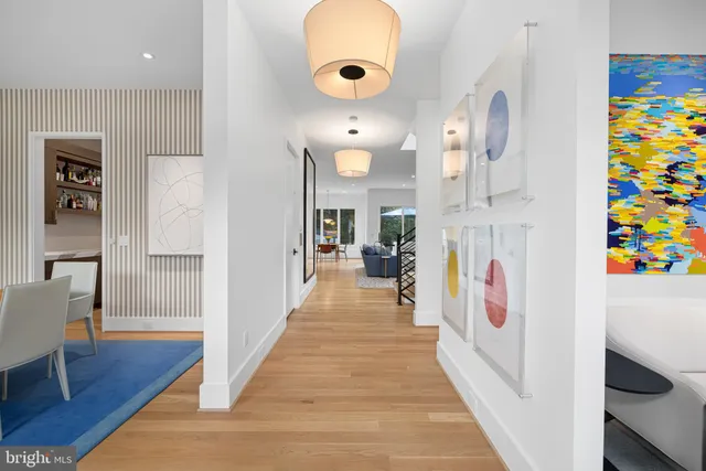 a living room with furniture and a book shelf