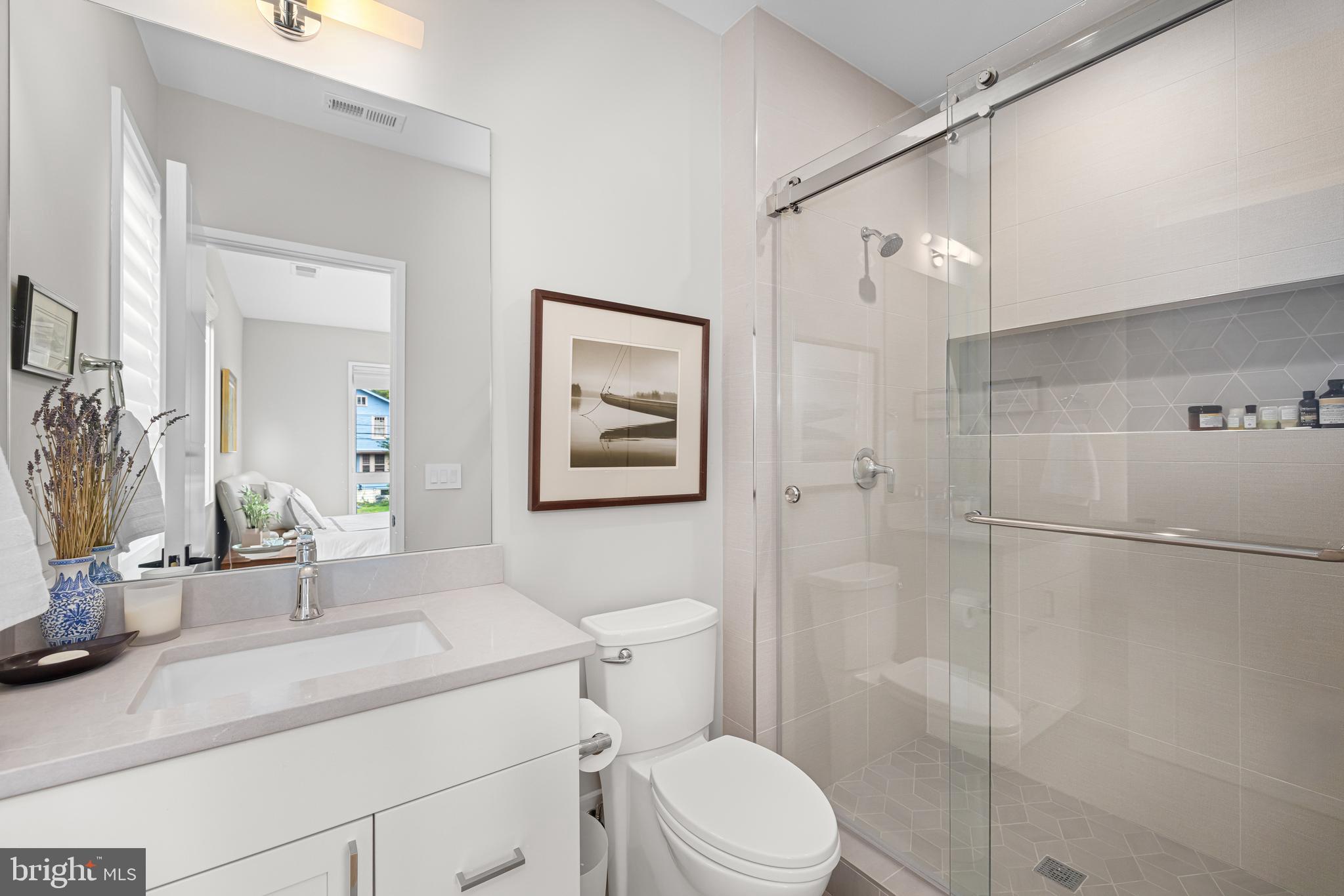 5624 Sherier Place Northwest Washington, DC 20016 - Photo 38 of 60 a bathroom with a sink a toilet and shower