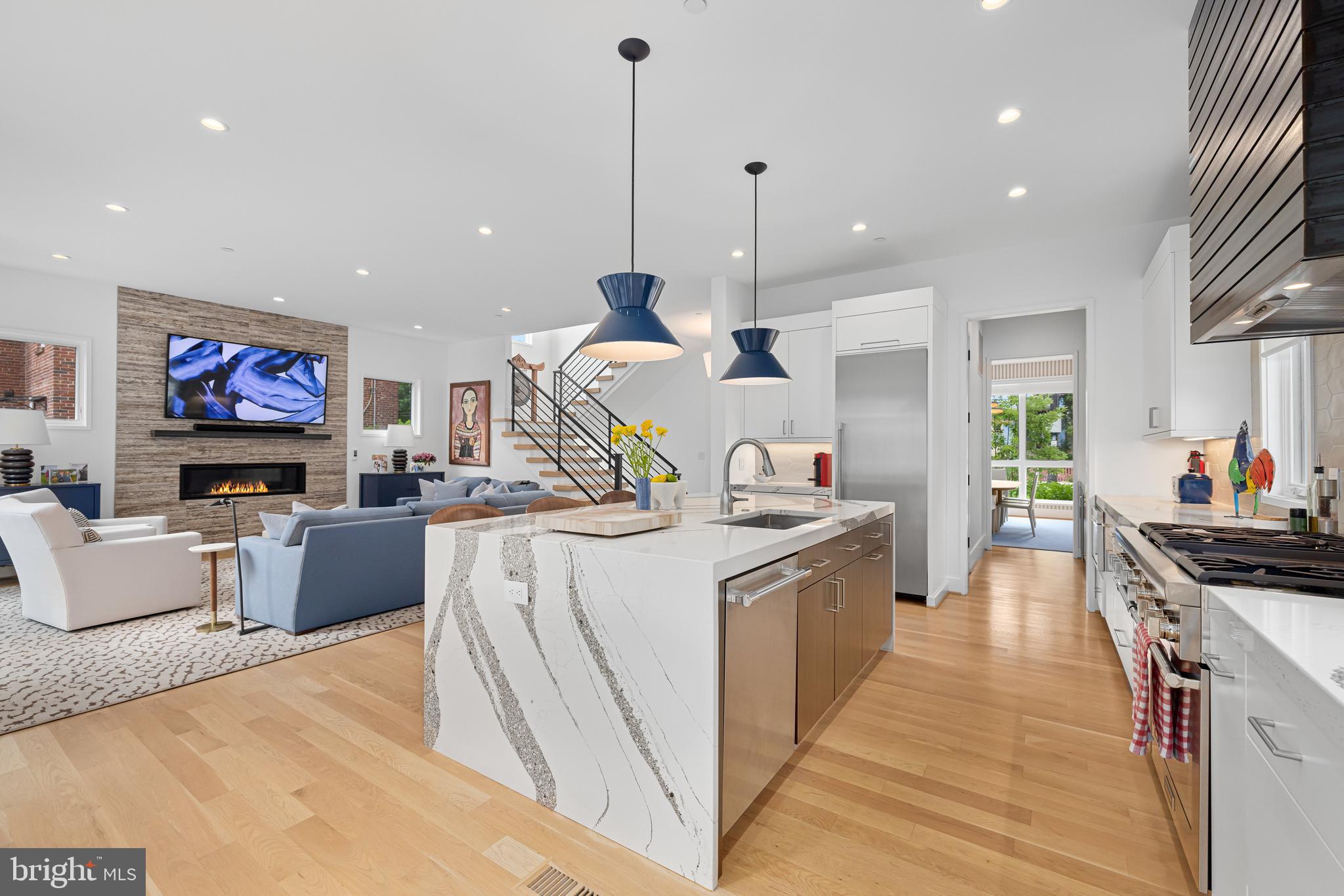 5624 Sherier Place Northwest Washington, DC 20016 - Photo 10 of 60 a kitchen with stainless steel appliances granite countertop a stove and a wooden floors