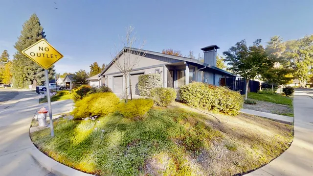 a view of a house with basketball court