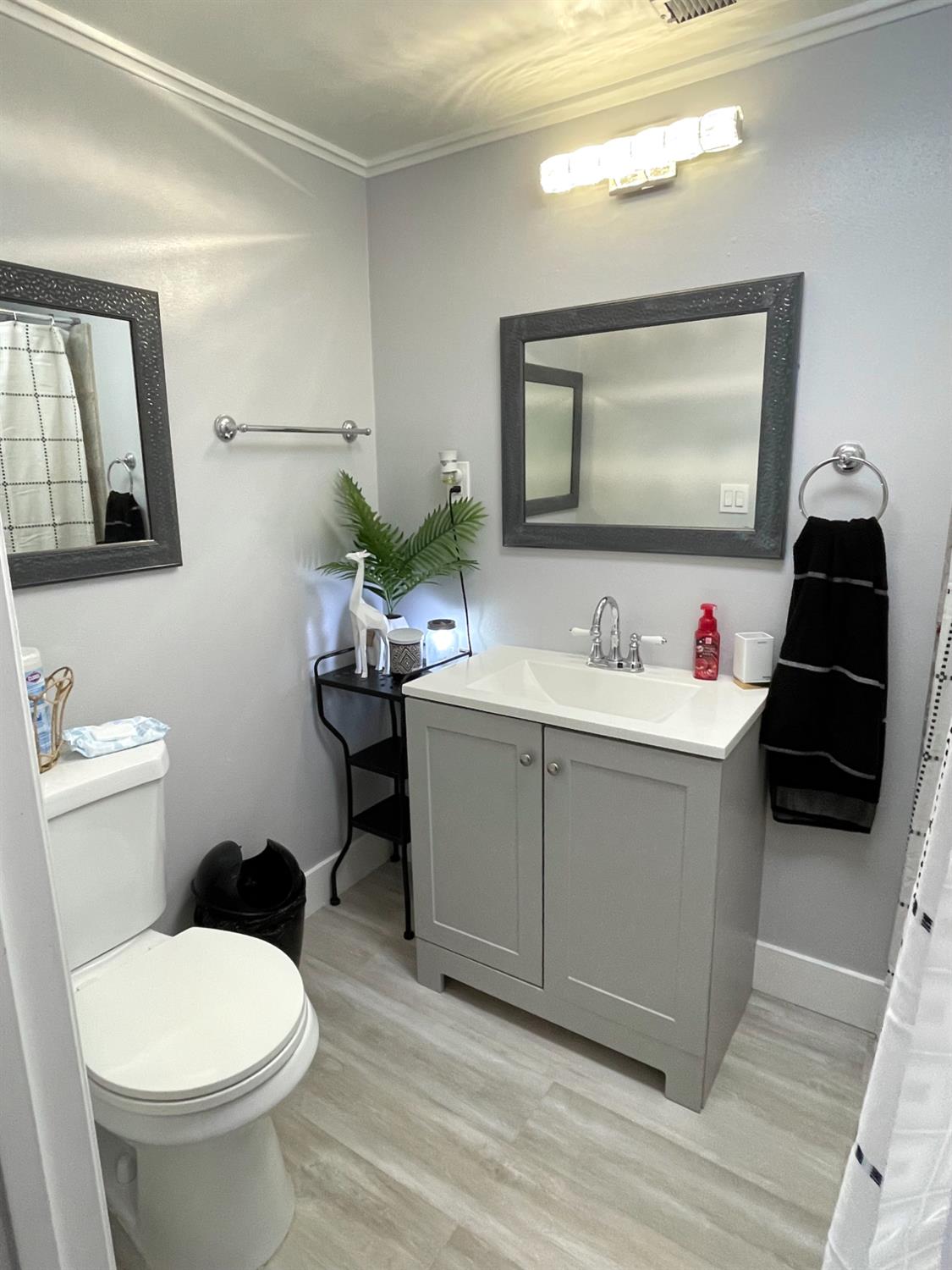 2313 Thomas Street Ceres, CA 95307 - Photo 16 of 35 a white toilet sitting next to a bathroom sink