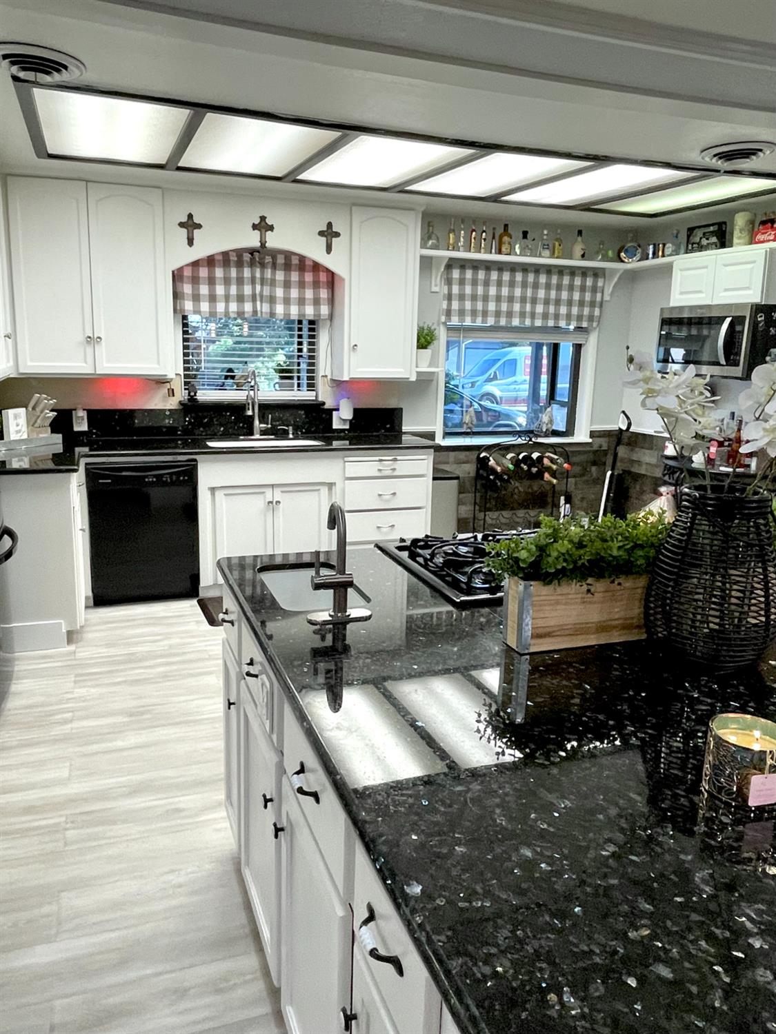 2313 Thomas Street Ceres, CA 95307 - Photo 9 of 35 a kitchen with stainless steel appliances granite countertop a sink and a stove