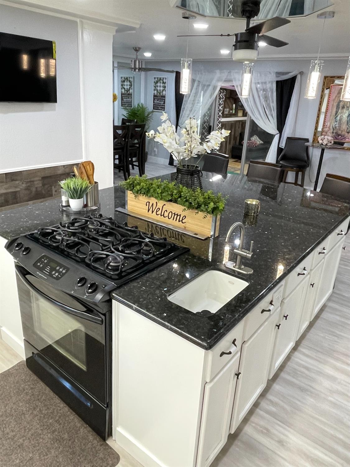 2313 Thomas Street Ceres, CA 95307 - Photo 10 of 35 a kitchen with stainless steel appliances granite countertop a stove and a sink