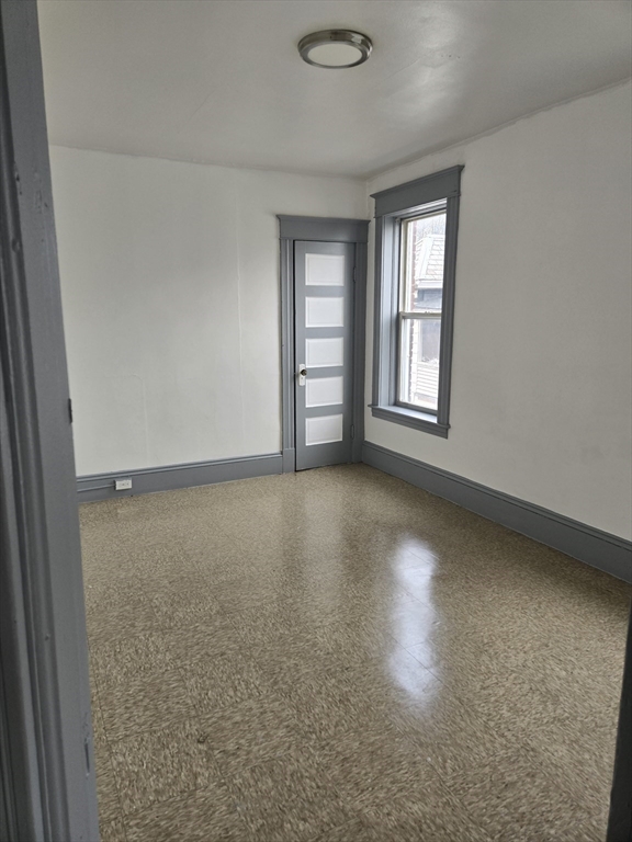 37 Clinton Avenue, Unit 3R Holyoke, MA 01040 - Photo 6 of 8 an empty room with a window