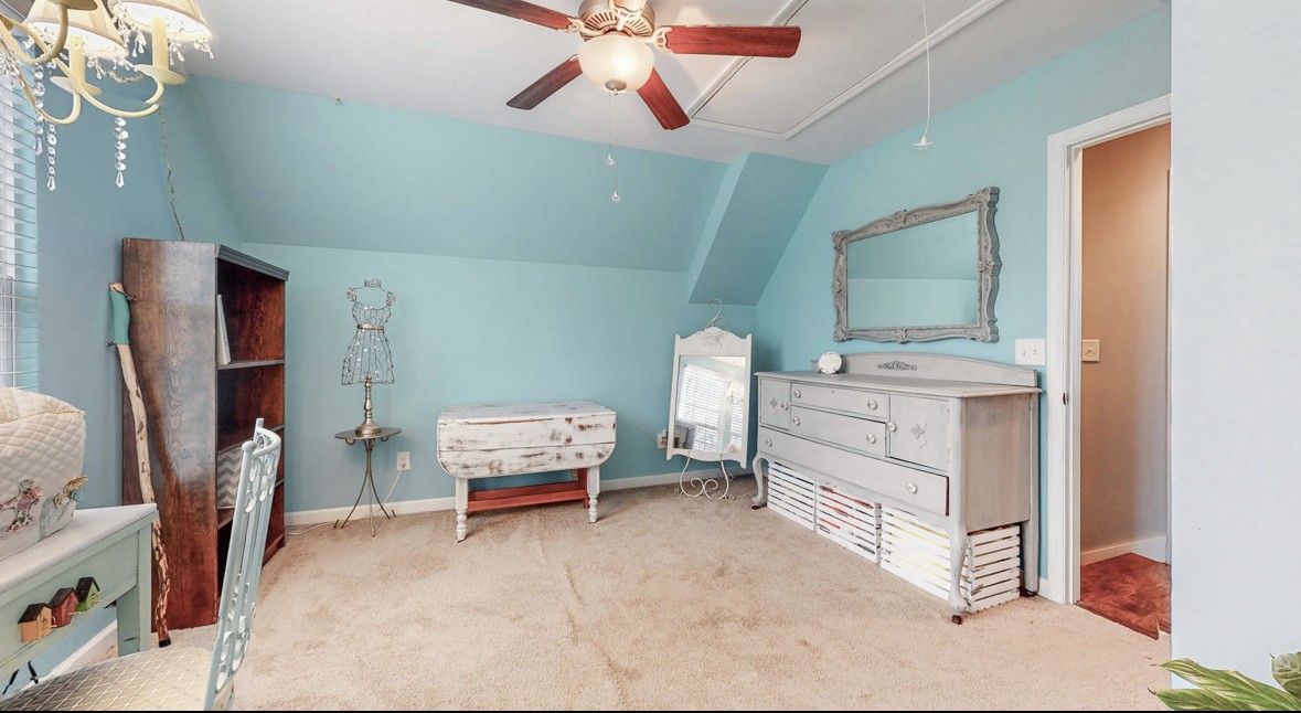 901 Hickory Ridge Road Lebanon, TN 37087 - Photo 3 of 43 a bedroom with bed and a chandelier