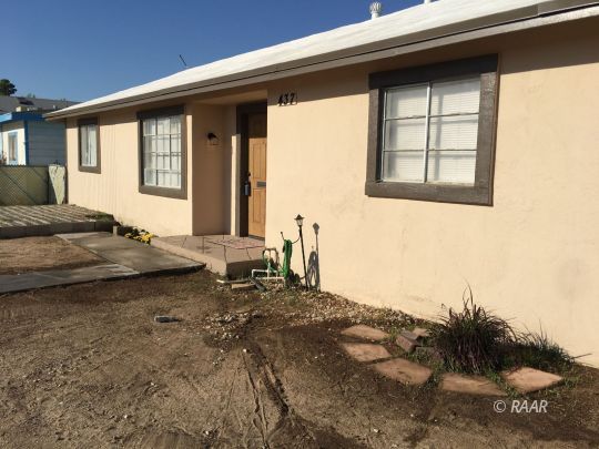 437 North Fairview Street Ridgecrest, CA 93555 - Photo 5 of 35 a bedroom with a bed and a window