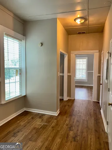 a view of an empty room and window