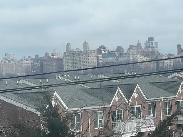 a view of room with window and hardwood floor