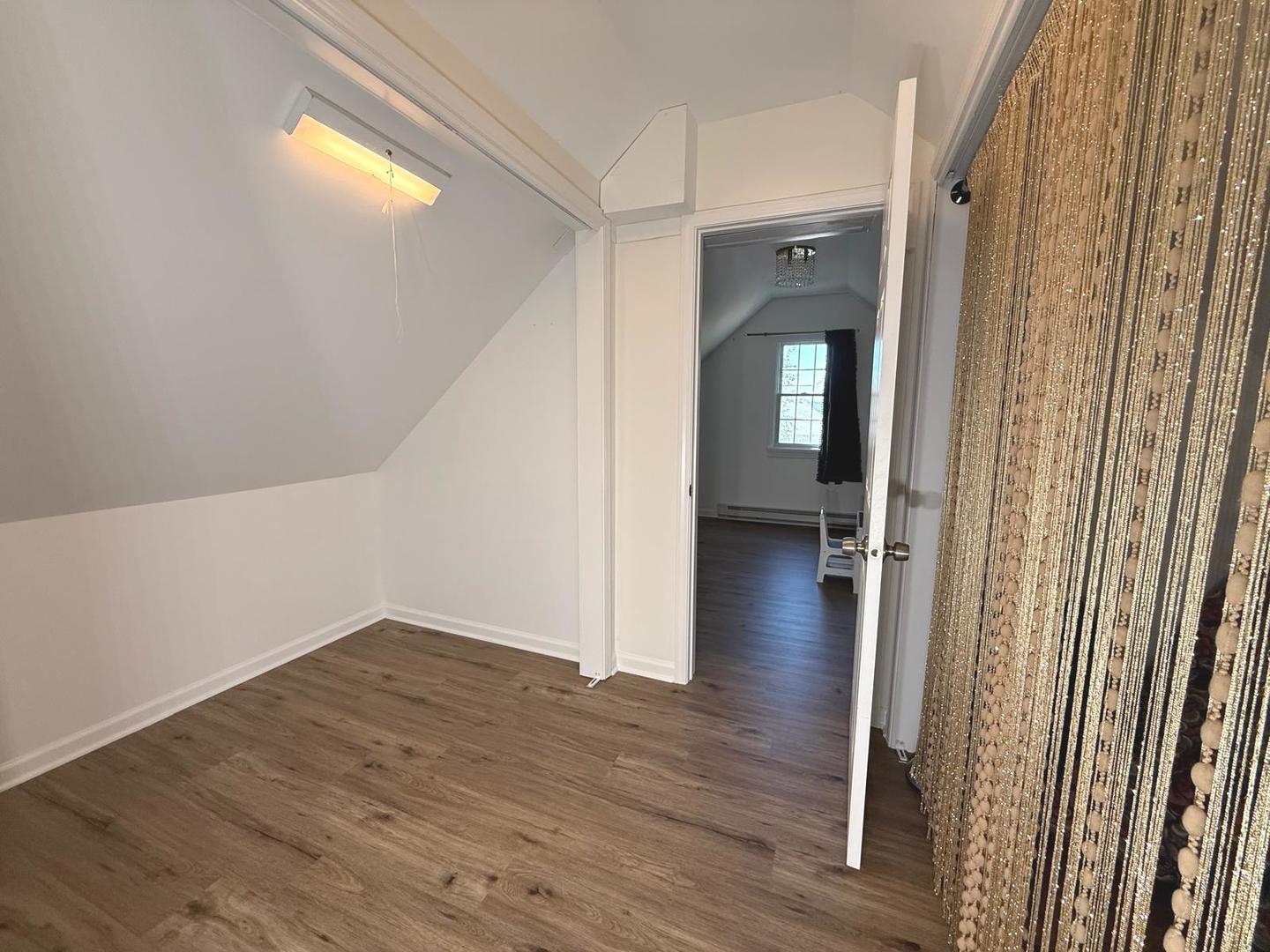 731 Lake Ridge Drive South Elgin, IL 60177 - Photo 16 of 28 a view of a hallway view with wooden floor and staircase