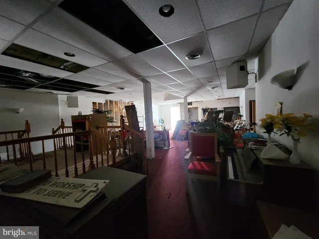 a view of a room with lots of wooden furniture
