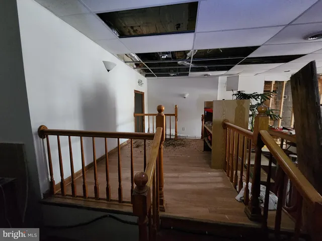 a view of staircase with wooden floor