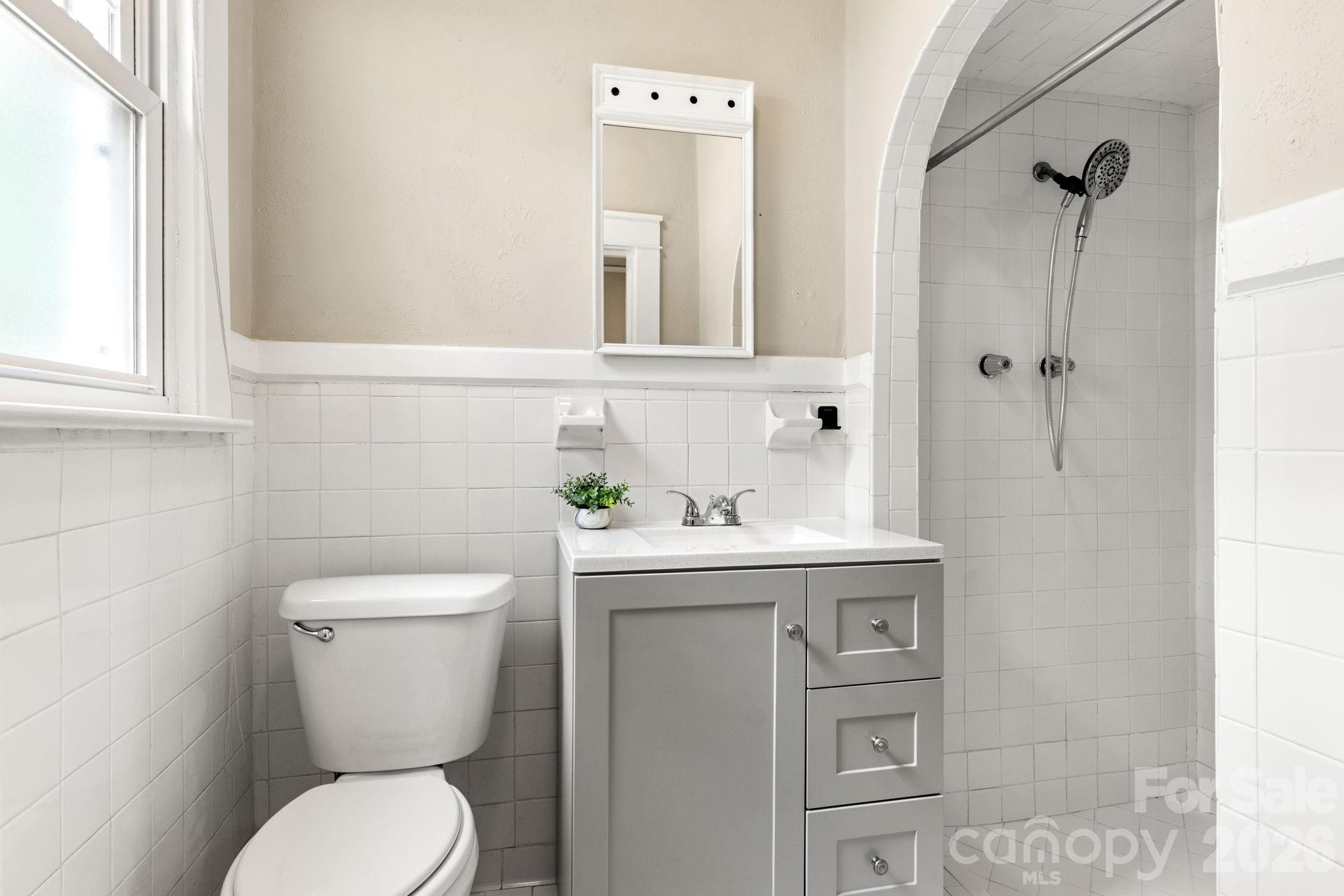 108 Reedy Street Chester, SC 29706 - Photo 21 of 42 a bathroom with a toilet sink and mirror