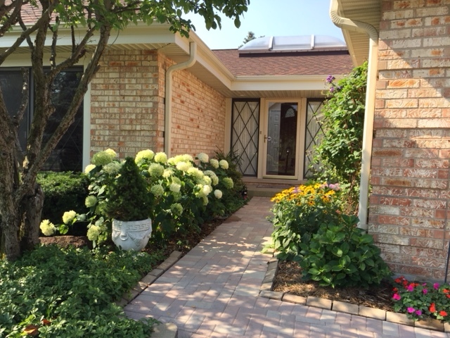 2305 Greenwood Road Northbrook, IL 60062 - Photo 2 of 25 a front view of a house with a yard