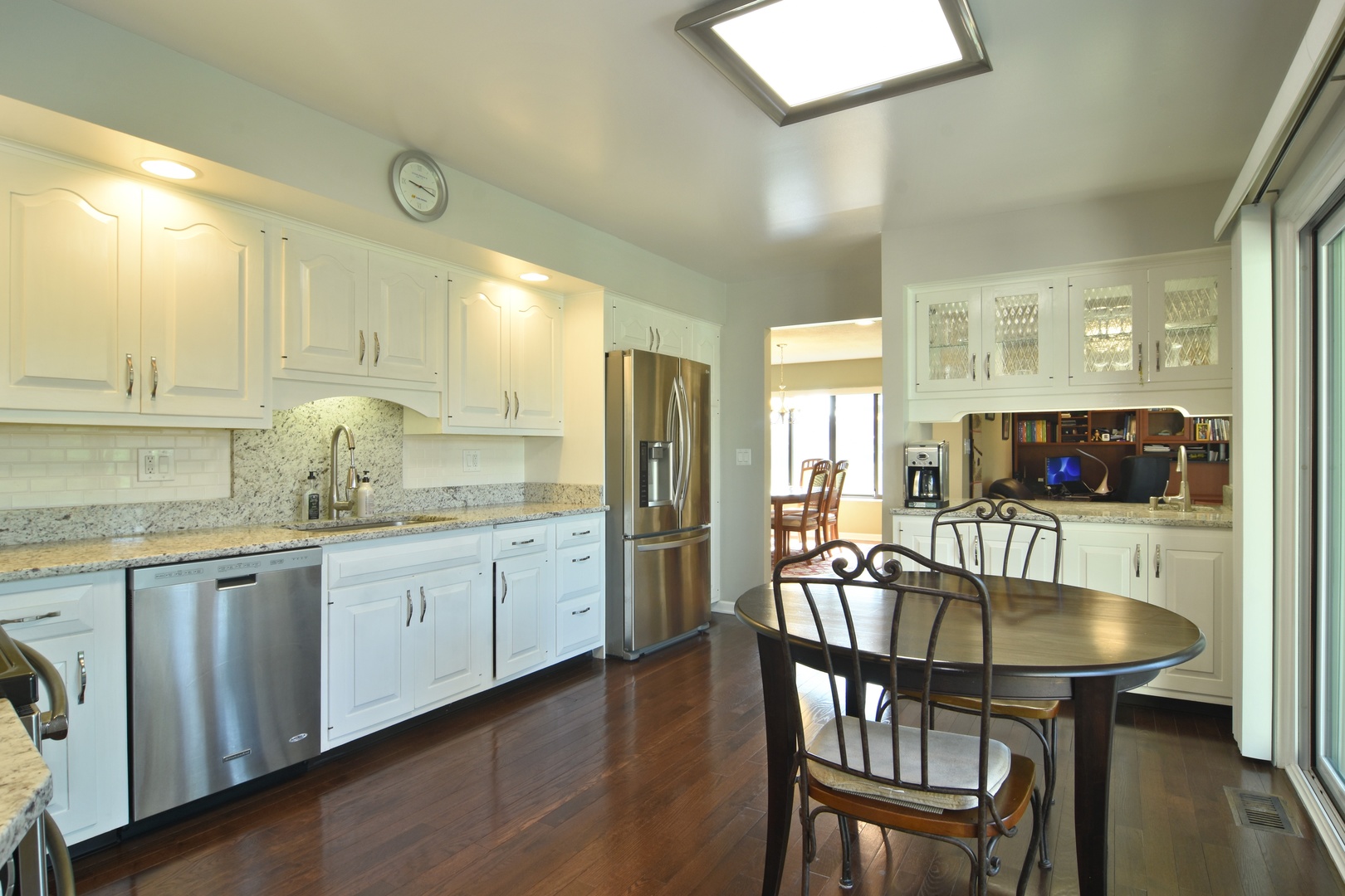 2305 Greenwood Road Northbrook, IL 60062 - Photo 13 of 25 a kitchen with granite countertop white cabinets and stainless steel appliances