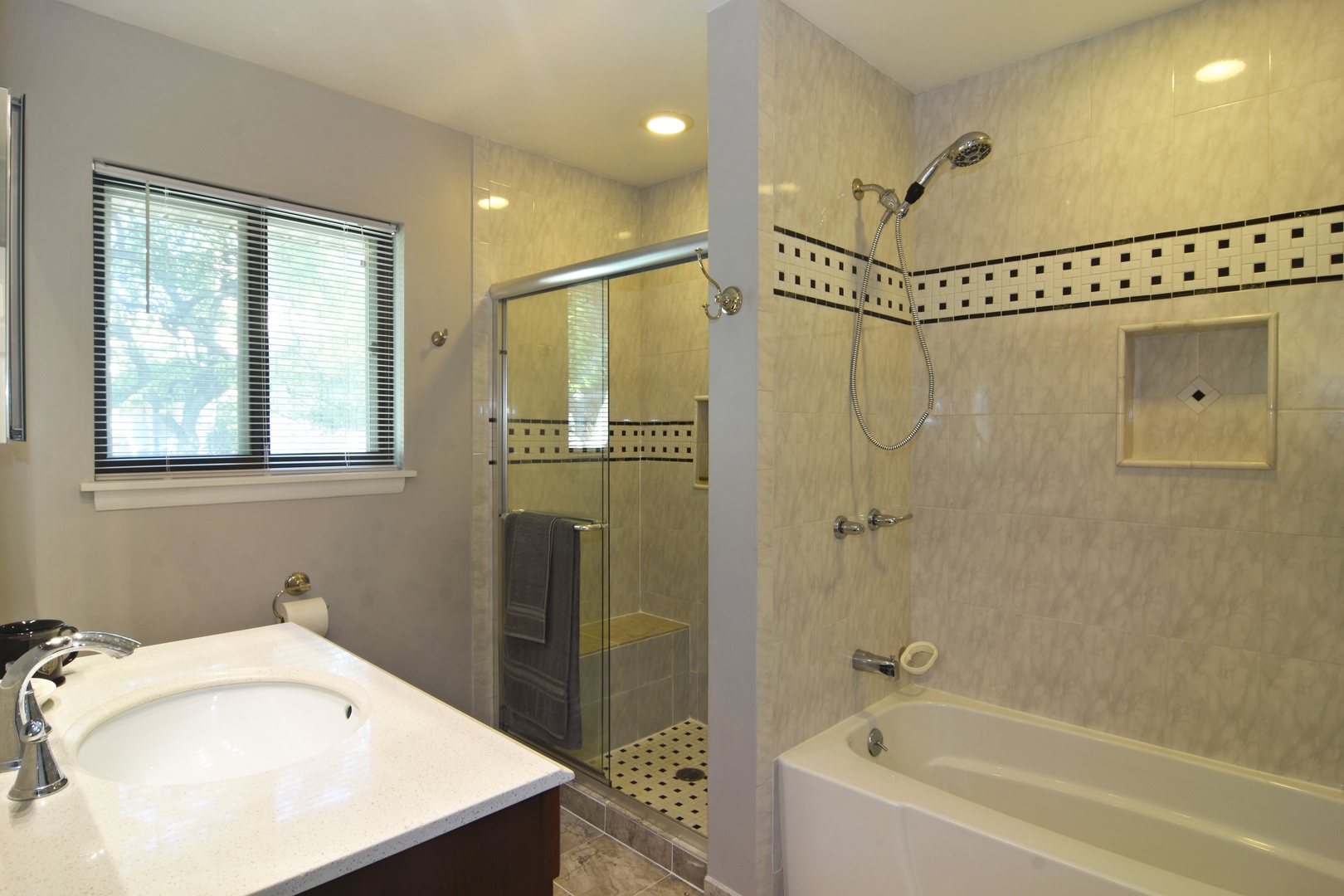 2305 Greenwood Road Northbrook, IL 60062 - Photo 18 of 25 a bathroom with a tub a sink and a shower