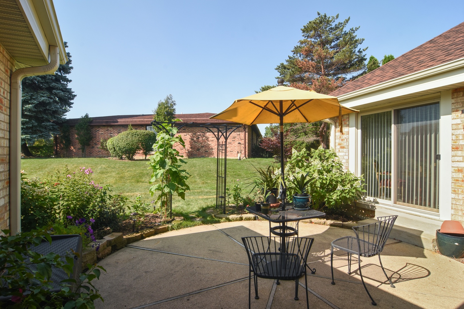 2305 Greenwood Road Northbrook, IL 60062 - Photo 23 of 25 a view of a chair and table in the backyard