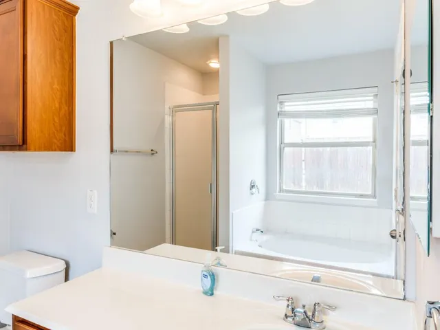 a bathroom with a bathtub and a shower
