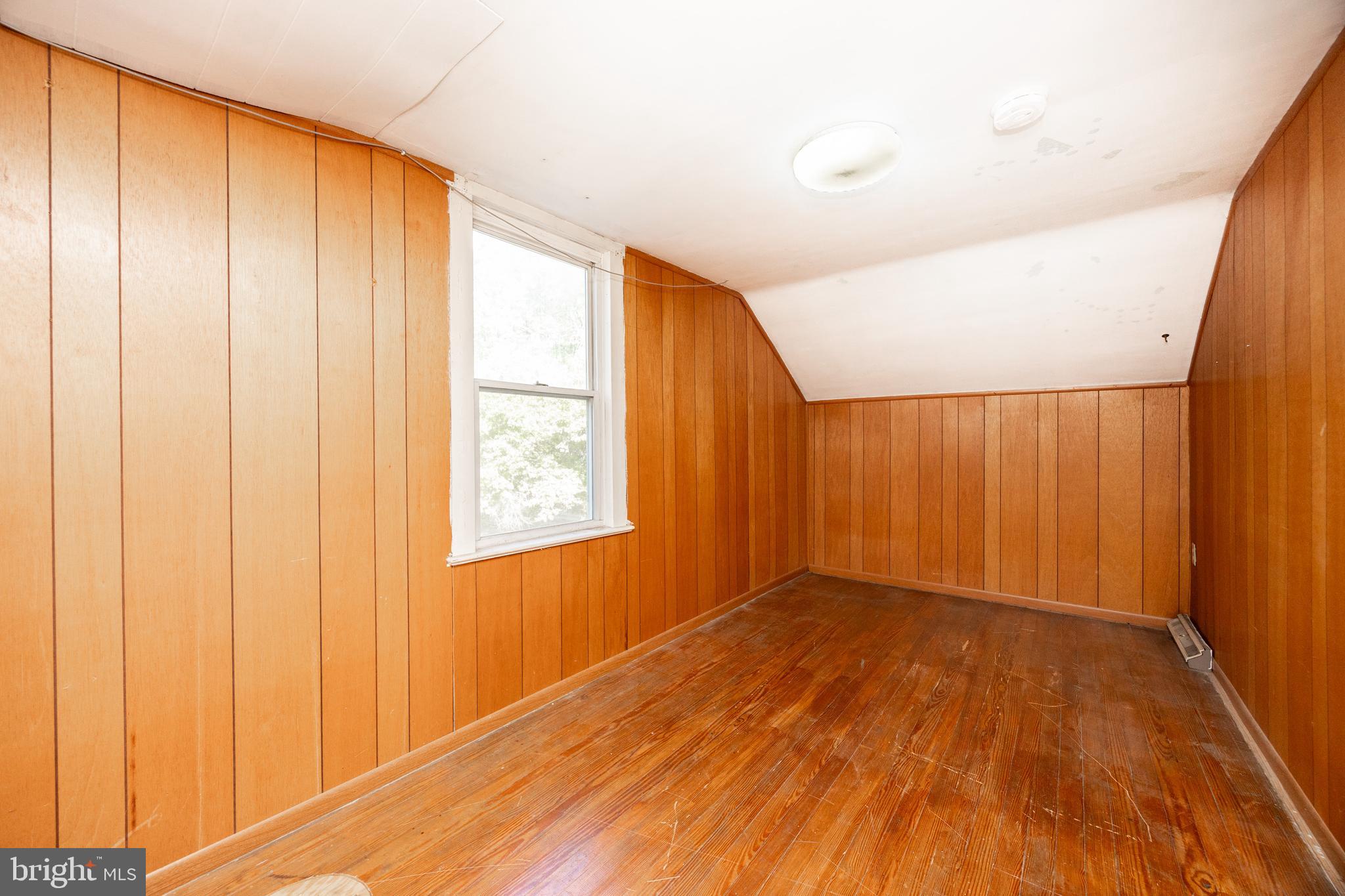 4 Boraten Road Royersford, PA 19468 - Photo 23 of 38 a view of an empty room with wooden floor and a window