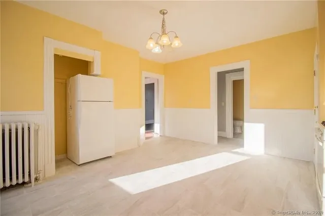 a view of a hallway with a chandelier