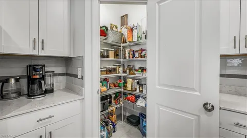 a kitchen with a refrigerator and cabinets