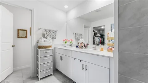 a kitchen with cabinets and window