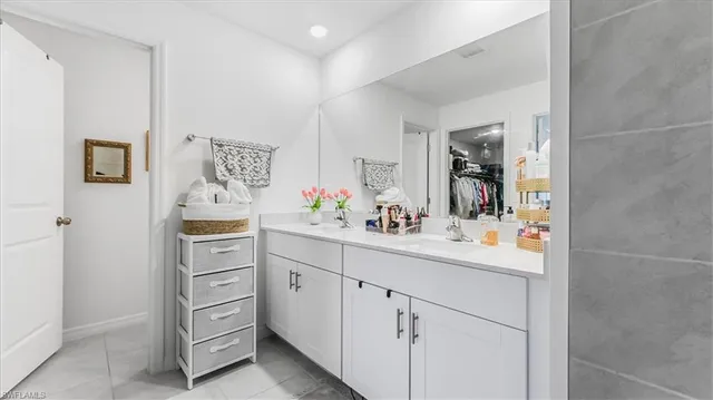 a kitchen with cabinets and window