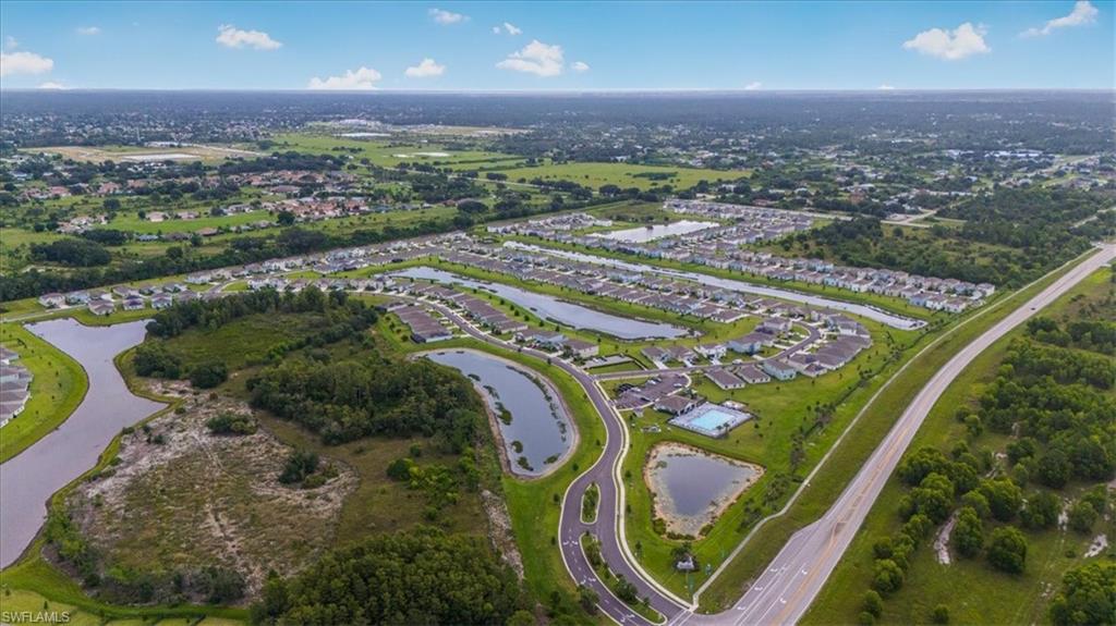 12252 Amber Waves Road Lehigh Acres, FL 33936 - Photo 32 of 35 an aerial view of a city