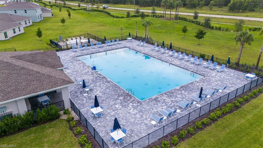 12252 Amber Waves Road Lehigh Acres, FL 33936 - Photo 34 of 35 an aerial view of a house with a yard