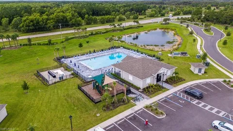 an aerial view of a house with a swimming pool yard and outdoor seating