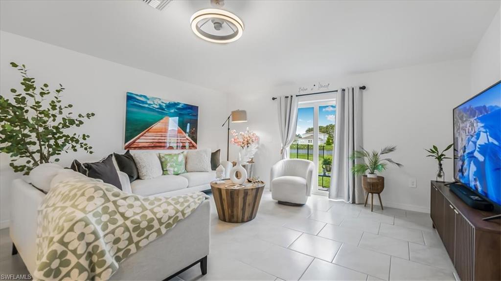 12252 Amber Waves Road Lehigh Acres, FL 33936 - Photo 5 of 35 a living room with furniture