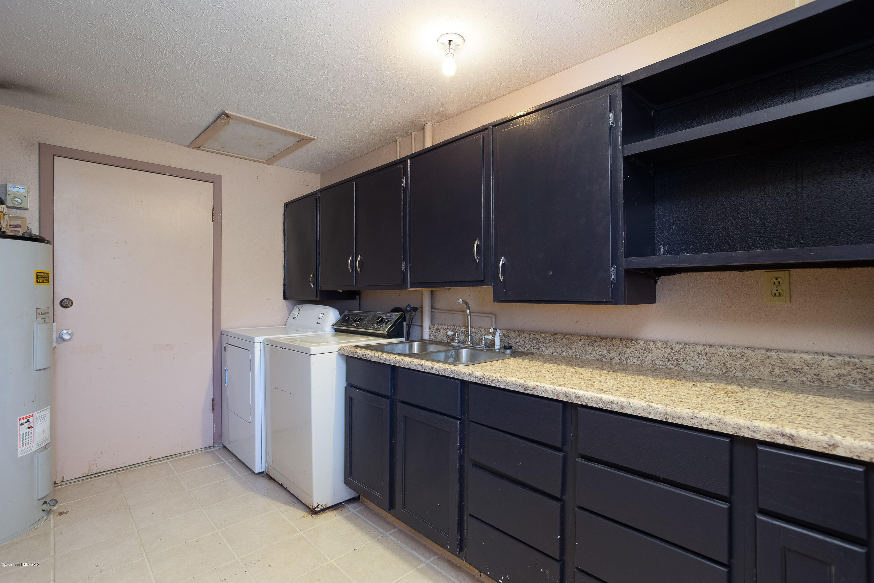 146 Bimini Road Cocoa Beach, FL 32931 - Photo 11 of 24 Large Laundry Room