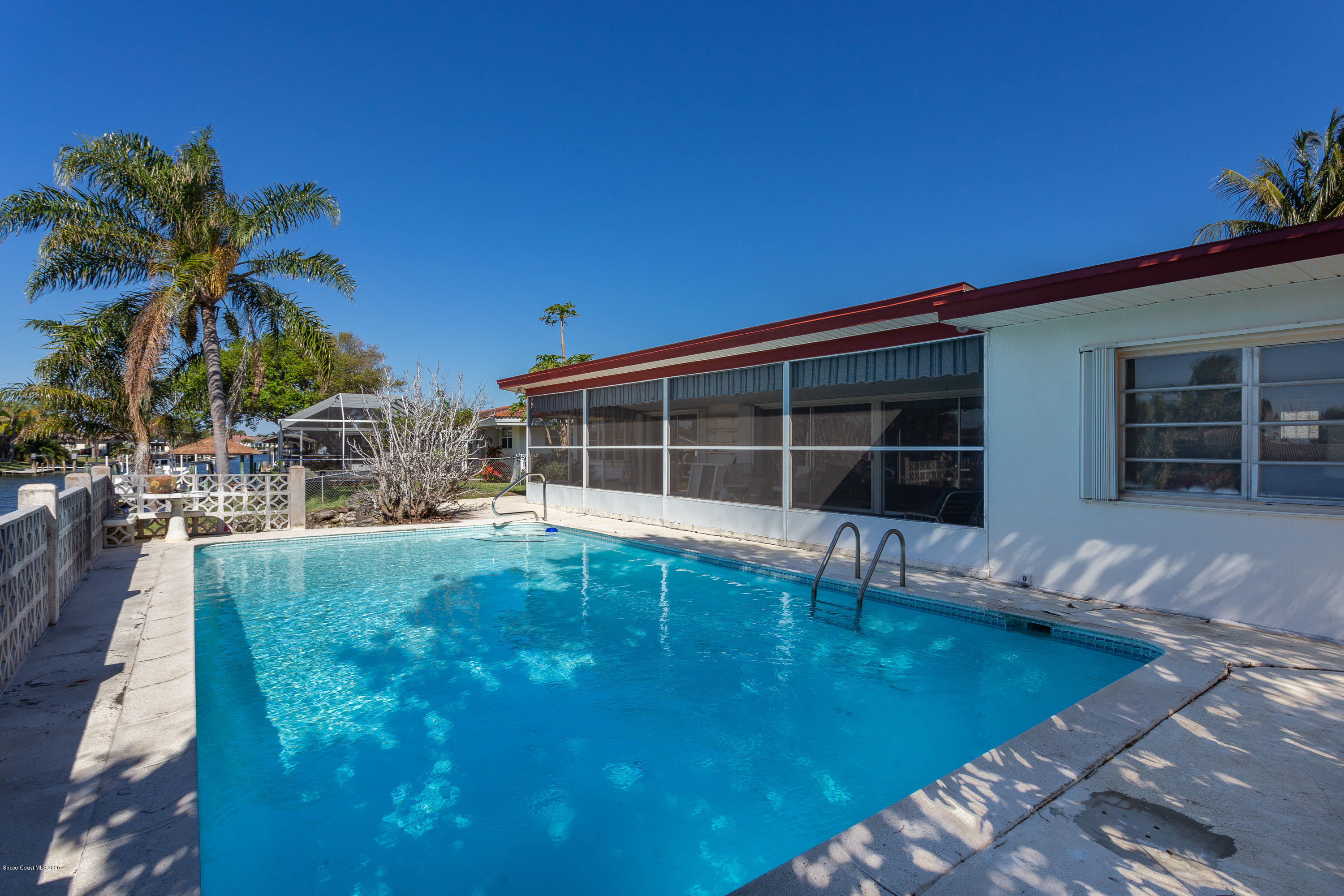 146 Bimini Road Cocoa Beach, FL 32931 - Photo 4 of 24 Pool & Rear Screened Porch