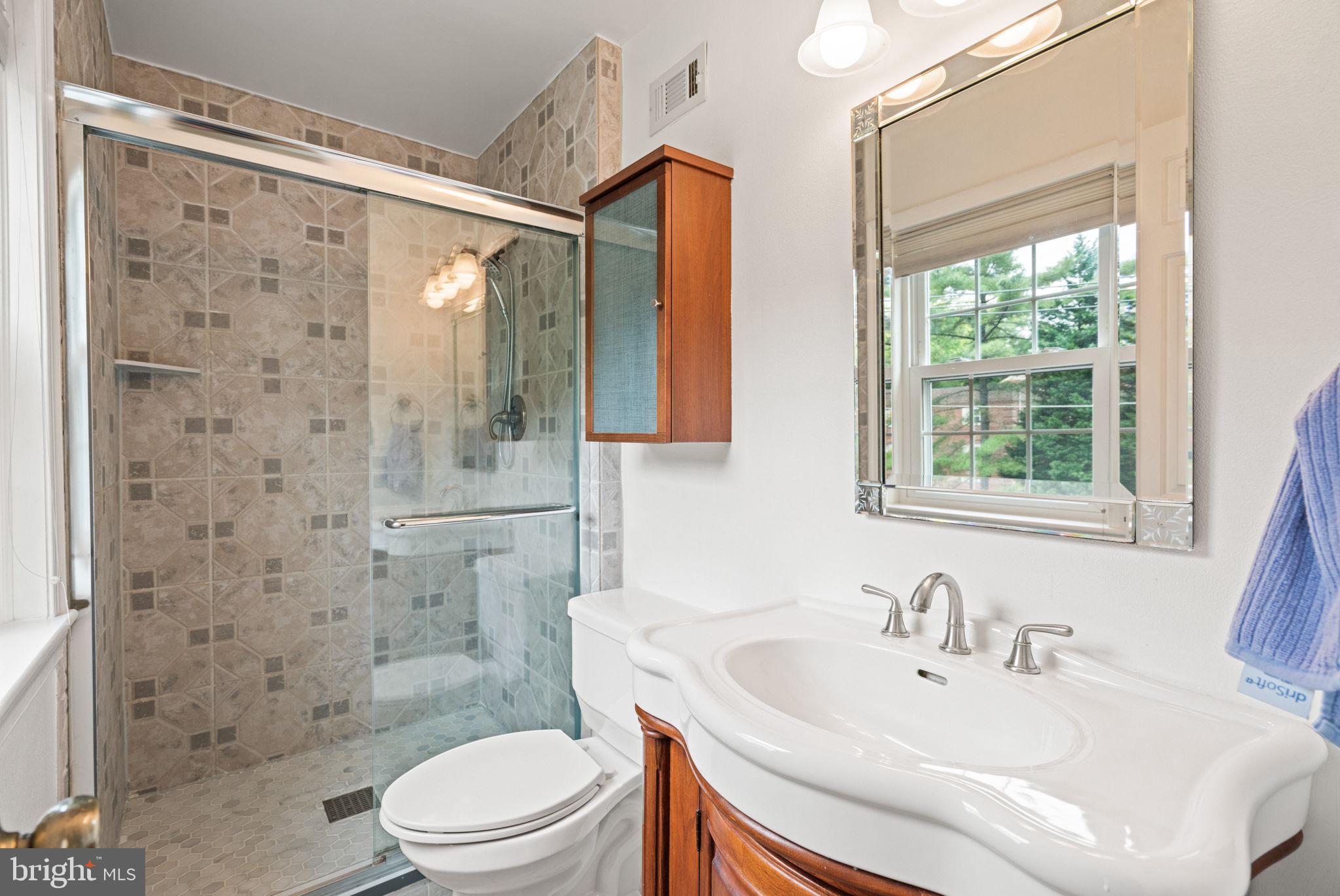 6607 Hillandale Road, Unit 89 Chevy Chase, MD 20815 - Photo 11 of 19 a bathroom with a sink toilet and shower