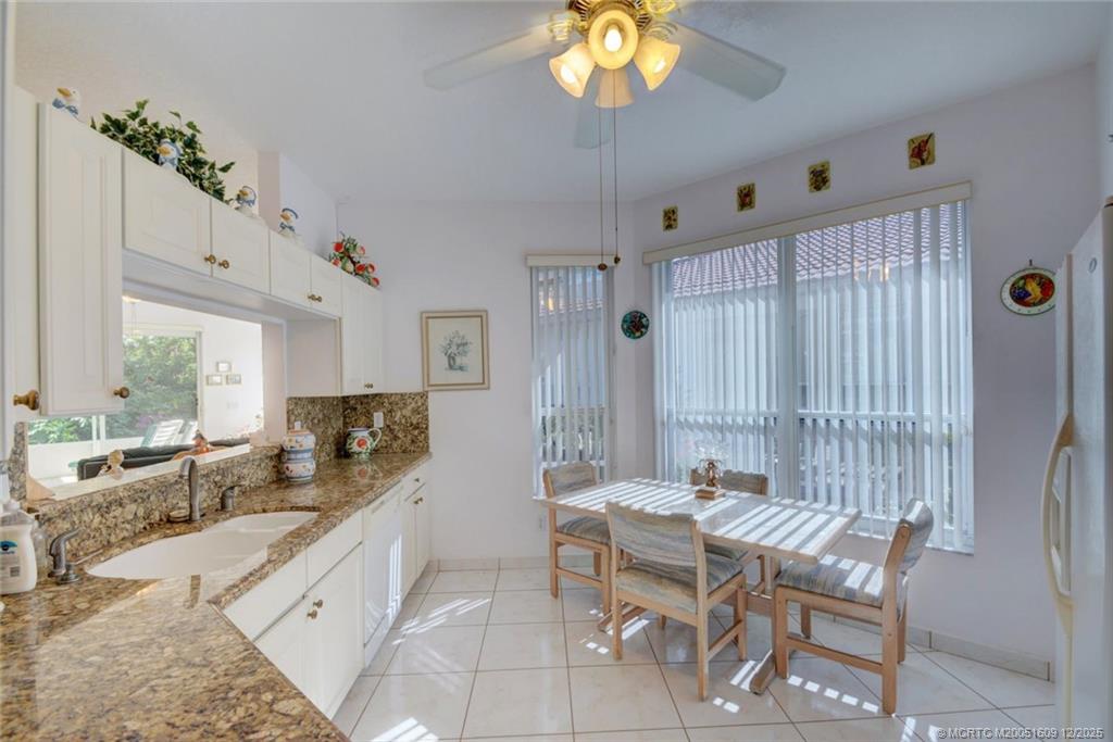 6789 Southeast Warwick Lane Stuart, FL 34997 - Photo 11 of 24 a dining room with furniture and window