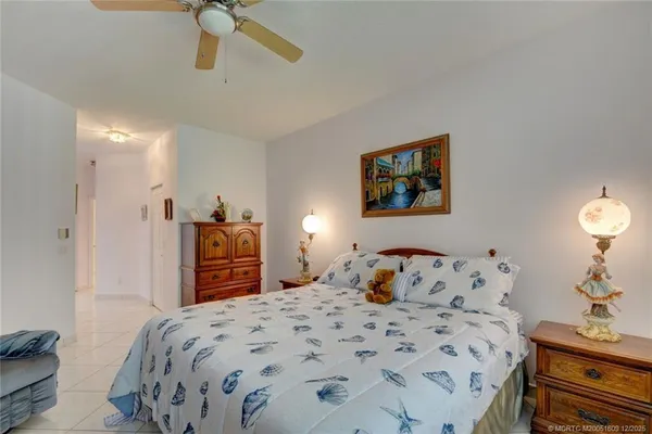 a bathroom with a tub a double vanity sink and a mirror